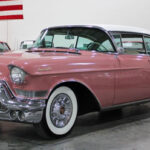 1957 Cadillac Coupe DeVille Dusty Rose Kentwood, MI on www.carstrucksbikesandboats.com