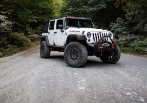 Lifted Jeep on Boost Your Ad Custom Cars For Sale, Inc.
